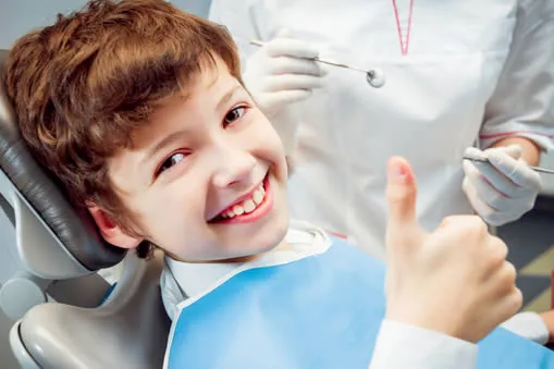 Young boy visiting pediatric dentist in Aventura FL